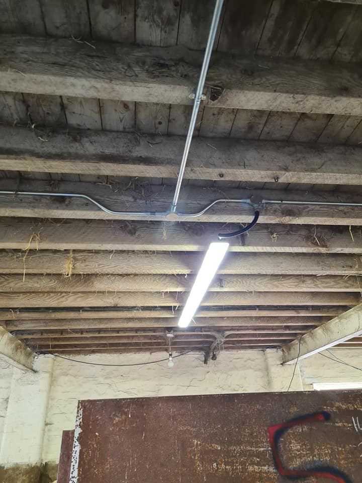 An LED batten light fitted under a barn roof